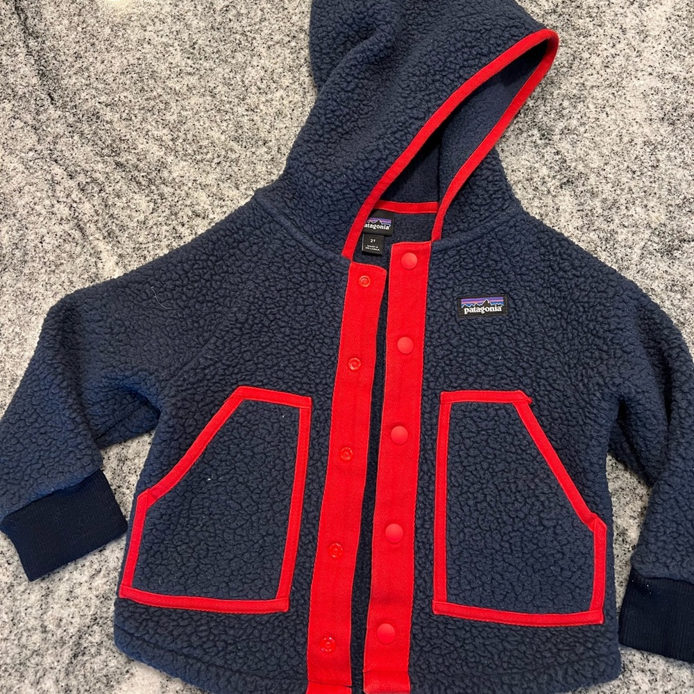 Navy and red pile fleece jacket. Lightly worn, in very good condition.